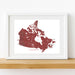 Framed map of Canada with a red outline on a white background