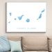 Framed map of the Canary Islands on a wall above a sofa.