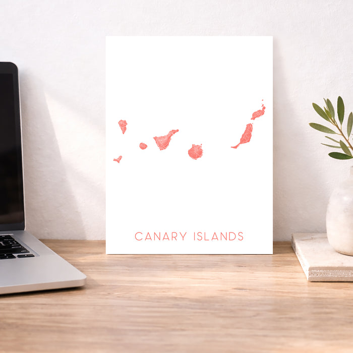 Poster of Canary Islands with a laptop and plant on a desk