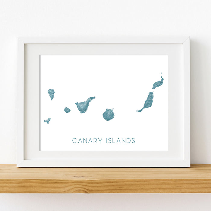 Framed map of the Canary Islands on a white wall