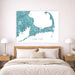 Map of Cape Cod on a wall above a bed in a bedroom setting