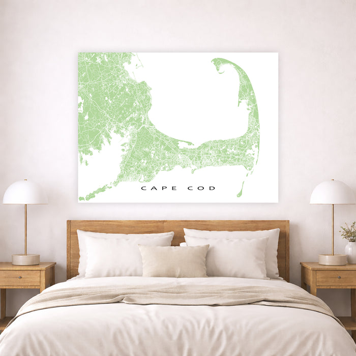 Map of Cape Cod on a wall above a bed in a bedroom setting