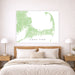 Map of Cape Cod on a wall above a bed in a bedroom setting