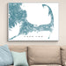 Map of Cape Cod on a wall above a beige sofa with light blue pillows.