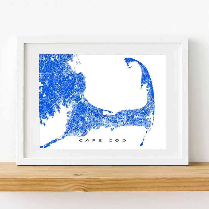 Framed map of Cape Cod with blue and white design on a white wall.