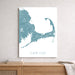Map of Cape Cod on a white wall above a wooden shelf.