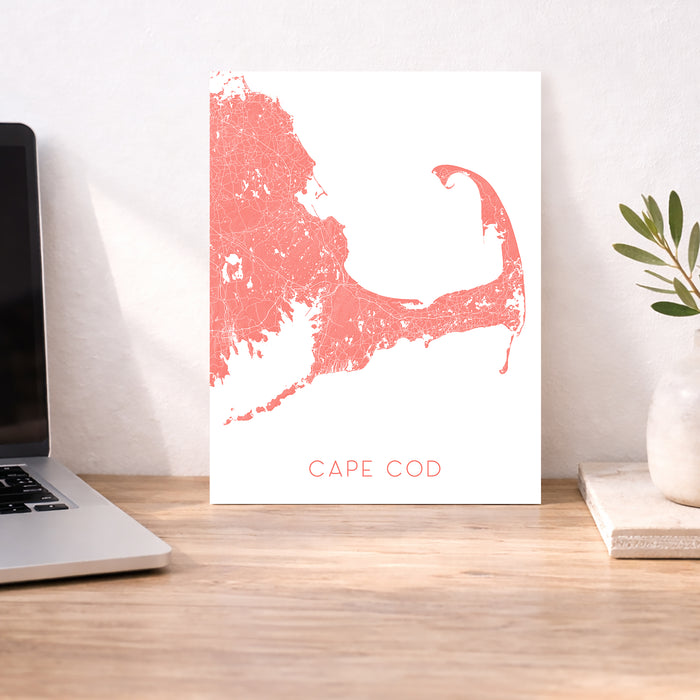 Cape Cod map print on a desk with a laptop and plant