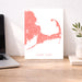 Cape Cod map print on a desk with a laptop and plant