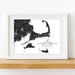 Framed black and white map of Cape Cod, Martha's Vineyard, and Nantucket on a wooden shelf.