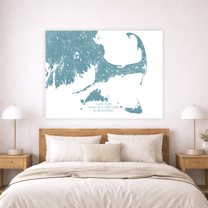 Bedroom with a map of Martha's Vineyard and Nantucket on the wall above a bed.