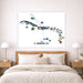 Map of the Caribbean with flags above a bed in a bedroom