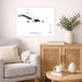Living room with a map of the Caribbean, beige sofa, wooden cabinet, and decorative items.