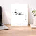 Map of the Caribbean on a white background next to a laptop on a wooden desk.