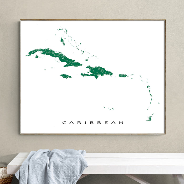 Framed map of the Caribbean on a wall above a white bench.