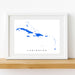 Framed map of the Caribbean on a white wall
