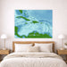 Map of the Caribbean on a wall above a bed in a bedroom.