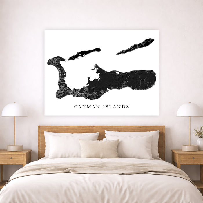 Map of the Cayman Islands on a wall above a bed in a bedroom.