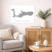 Living room with a map of Grand Cayman on the wall, a couch, and a wooden cabinet.