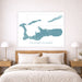Framed map of the Cayman Islands above a bed in a bedroom setting.