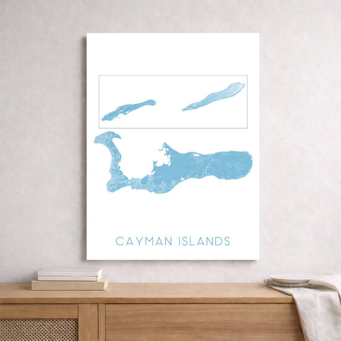 Map of the Cayman Islands on a white background, framed and displayed on a wall.