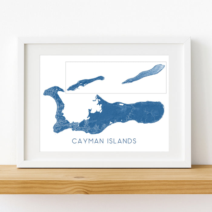 Framed map of the Cayman Islands on a white wall