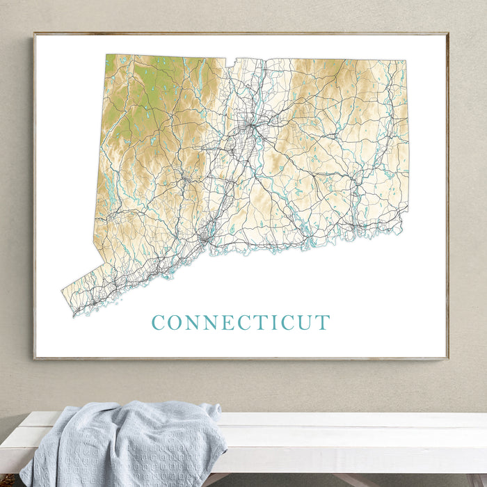 Framed map of Connecticut on a wall above a white surface with a gray towel.