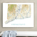 Framed map of Connecticut on a wall above a white surface with a gray towel.