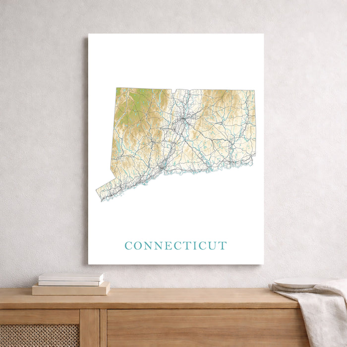 Map of Connecticut on a wall above a wooden surface