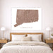 Bedroom with a map of Connecticut on the wall above a bed.