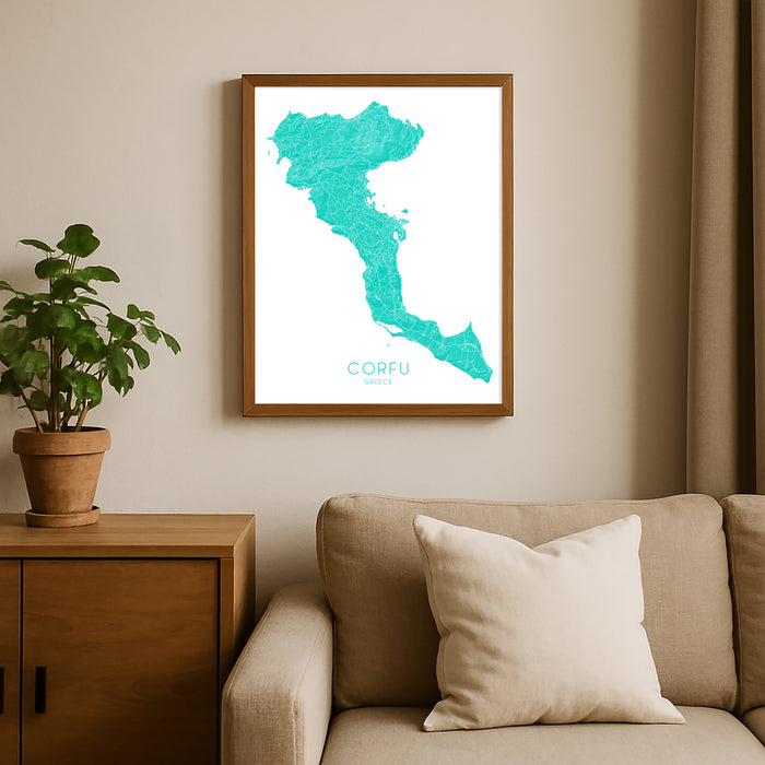 Framed map of Corfu on a wall above a sofa with a plant beside it.