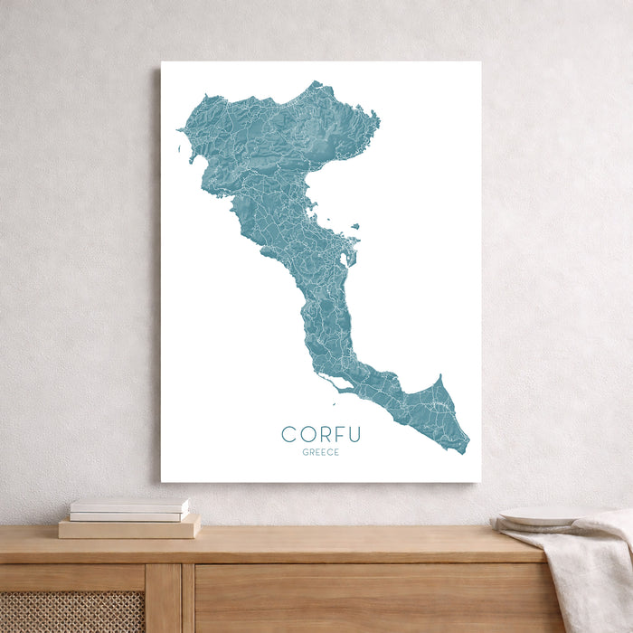 Map of Corfu, Greece on a white background above a wooden surface.