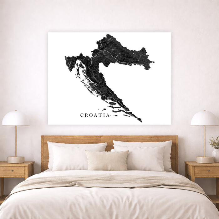 Map of Croatia on a wall above a bed in a bedroom setting