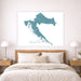 Map of Croatia on a wall above a bed in a bedroom