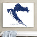 Framed map of Croatia on a wall above a white surface.