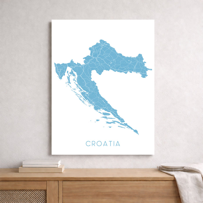 Map of Croatia on a white background above a wooden surface.