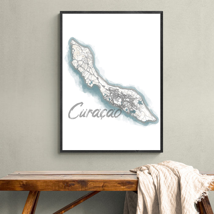 Framed map of Curaçao on a wall above a wooden bench.