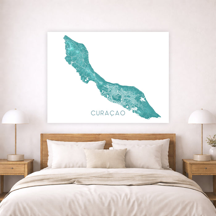 Map of Curacao on a wall above a bed in a bedroom