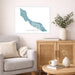 Living room with a map of Curaçao on the wall, a vase with plants, and a coffee table with books and a mug.