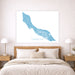 Map of Curacao on a wall above a bed in a bedroom setting