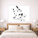 Map of Cyclades Islands on a wall above a bed in a bedroom.