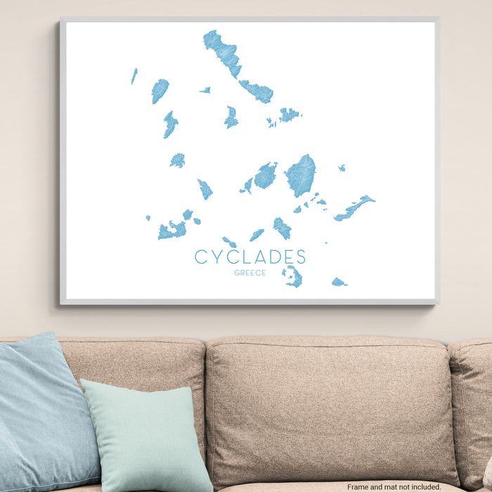 Framed map of Cyclades Islands on a wall above a sofa