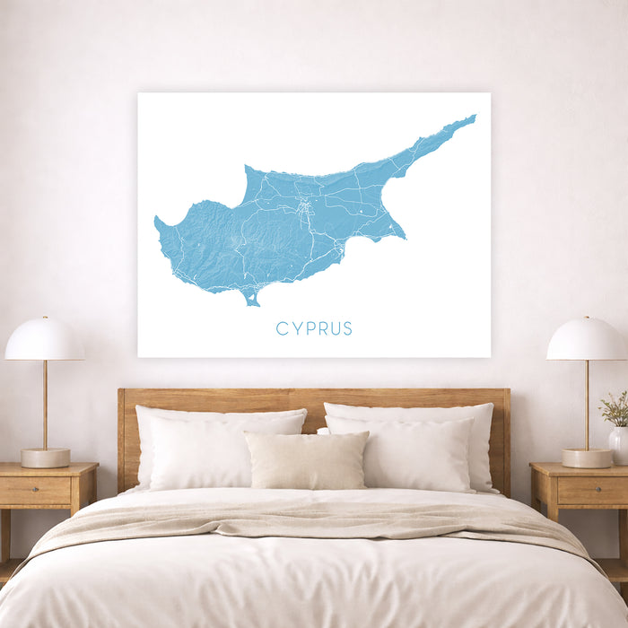 Map of Cyprus on a wall above a bed in a bedroom setting