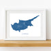 Framed map of Cyprus on a white wall