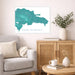 Living room with a map of the Dominican Republic on the wall, a couch, and a wooden side table.