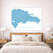 Map of the Dominican Republic on a wall above a bed in a bedroom.