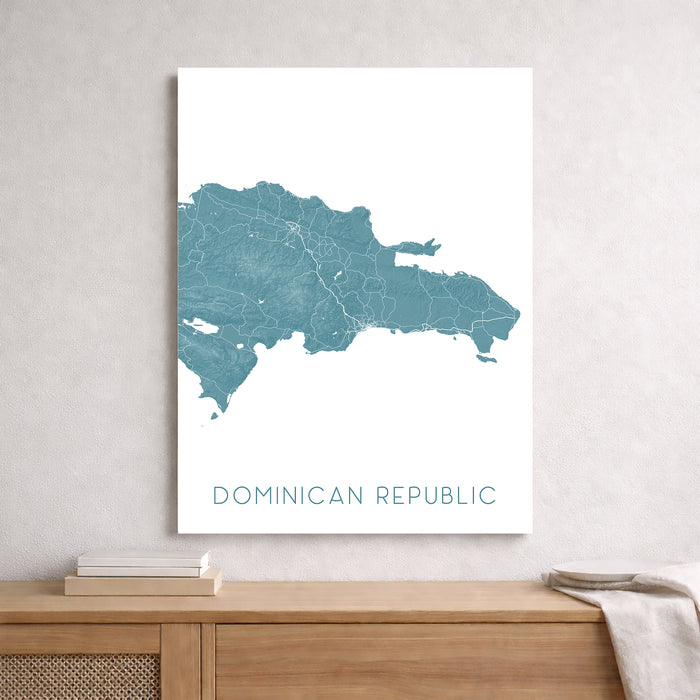 Map of the Dominican Republic on a white wall above a wooden shelf.