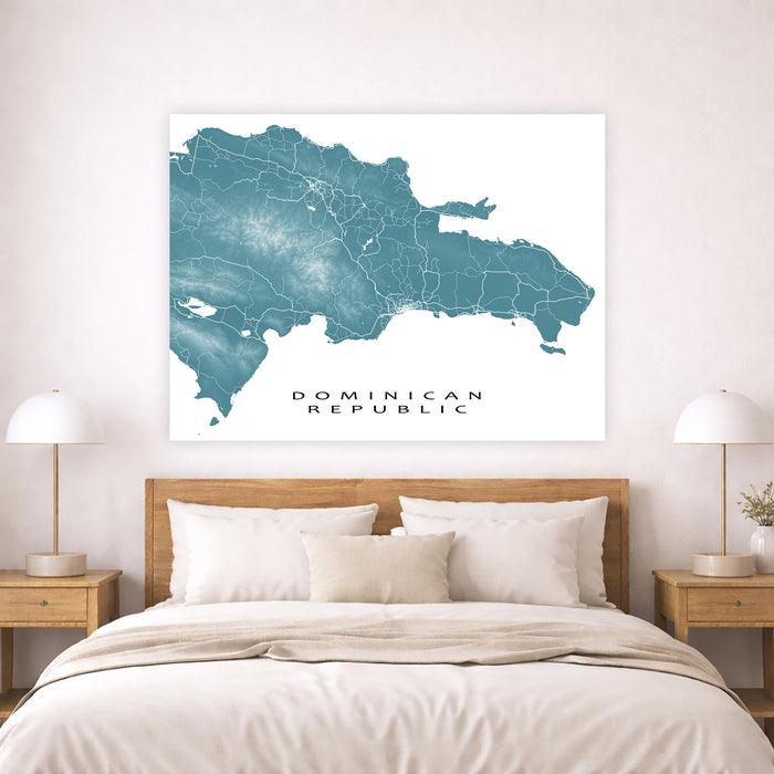Map of the Dominican Republic on a wall above a bed in a bedroom.