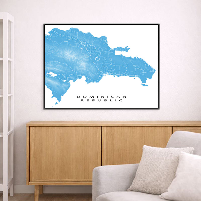 Framed map of the Dominican Republic on a wall above a wooden cabinet and sofa.