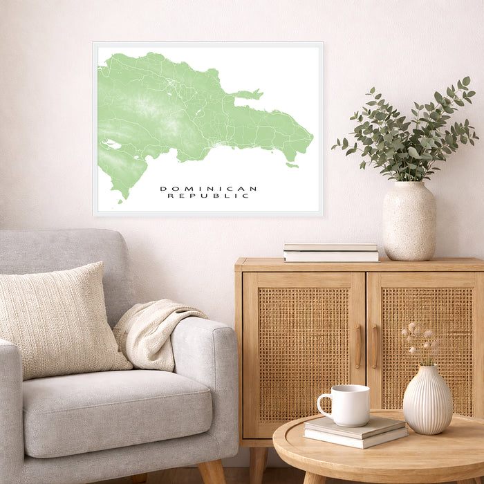 Living room with a map of the Dominican Republic on the wall, a vase with plants, and a wooden cabinet.