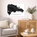 Framed map of the Dominican Republic in a living room setting with a couch, cabinet, and decorative items.